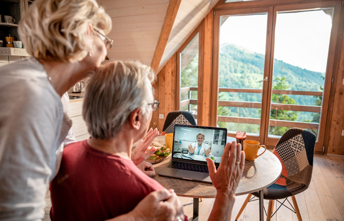 couple talking to doctor on computer